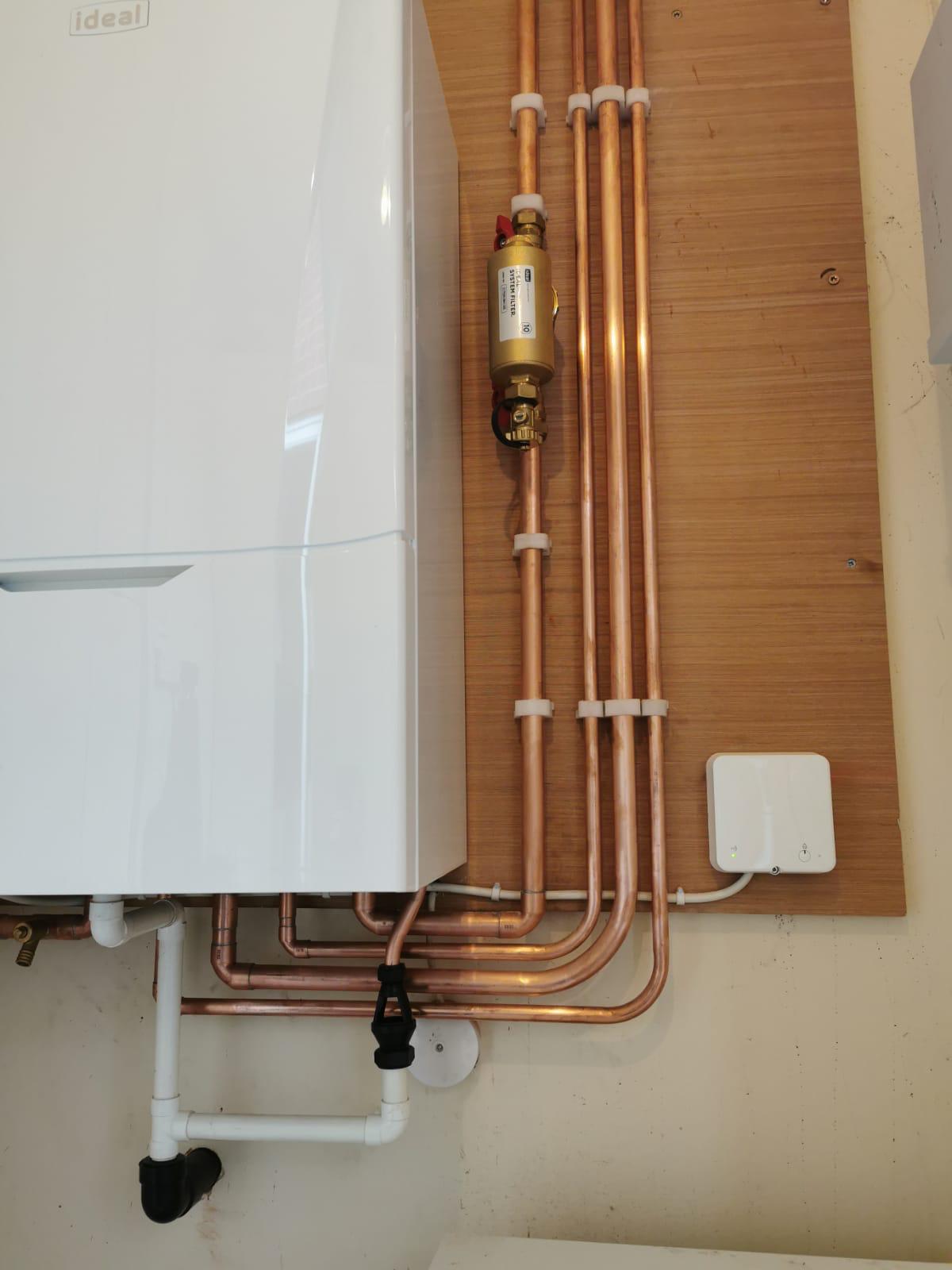 Supplying the best brand boilers, we love this example of a Ideal boiler, neatly fitted with exposed copper pipes.